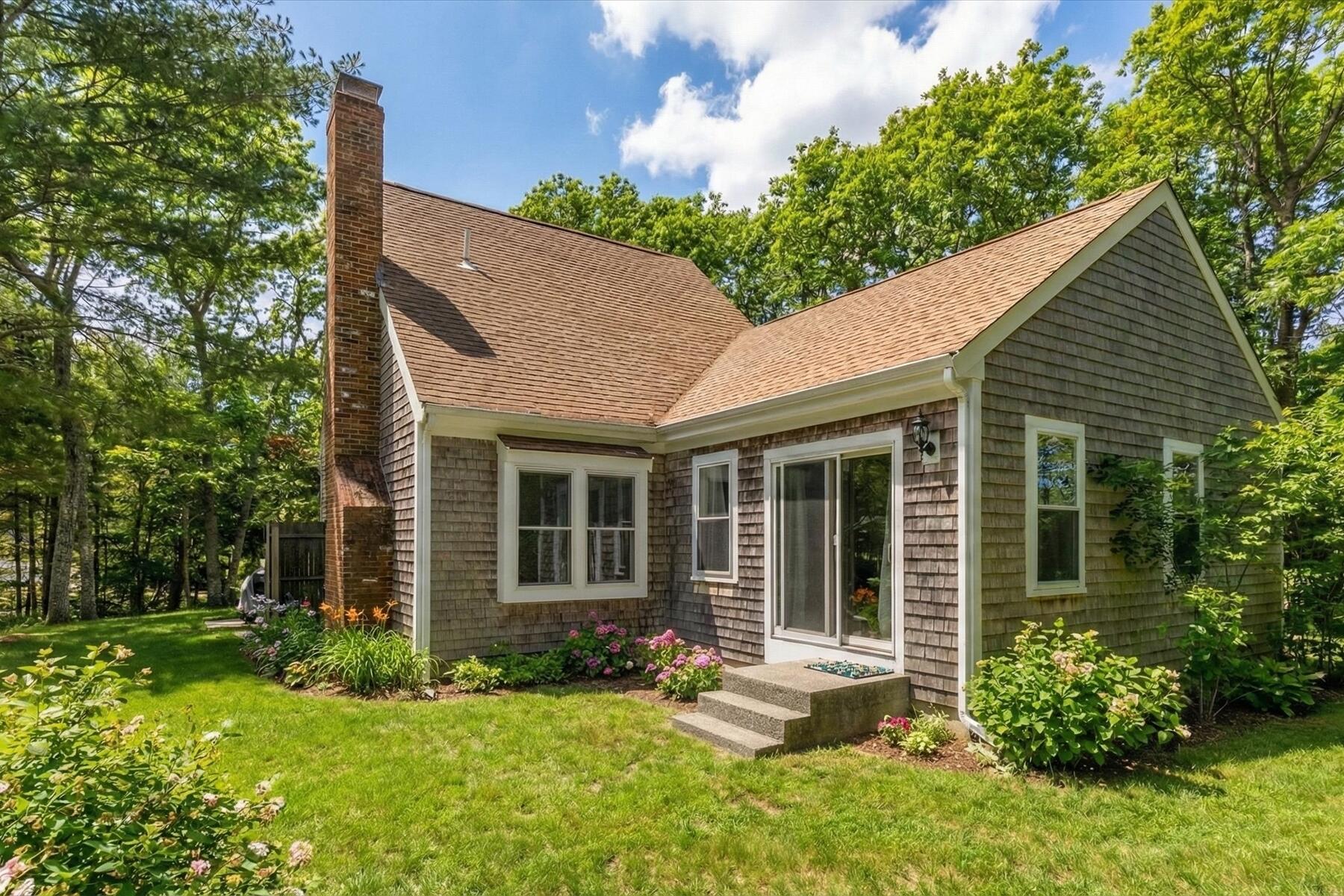 82 Old Fields Road Sandwich, MA 02563 - Photo 7 of 34 front view of a house with a yard