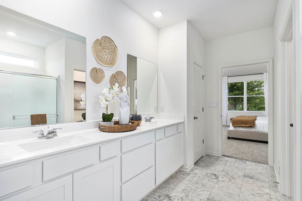 6412 Stony Brook Lane Wonder Lake, IL 60097 - Photo 24 of 36 a bathroom with a double vanity sink and a mirror