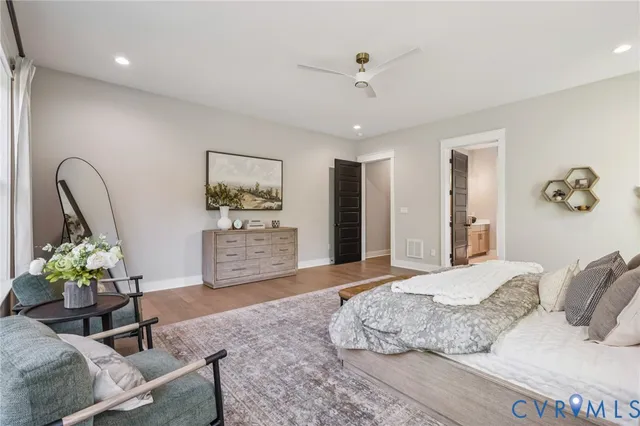 a bedroom with a bed furniture and a potted plant
