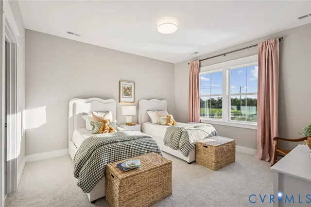 a bedroom with bed and a large window