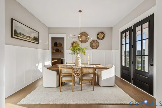 a view of a dining room with furniture window and wooden floor