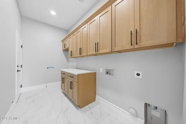 a view of an empty room with a ceiling fan
