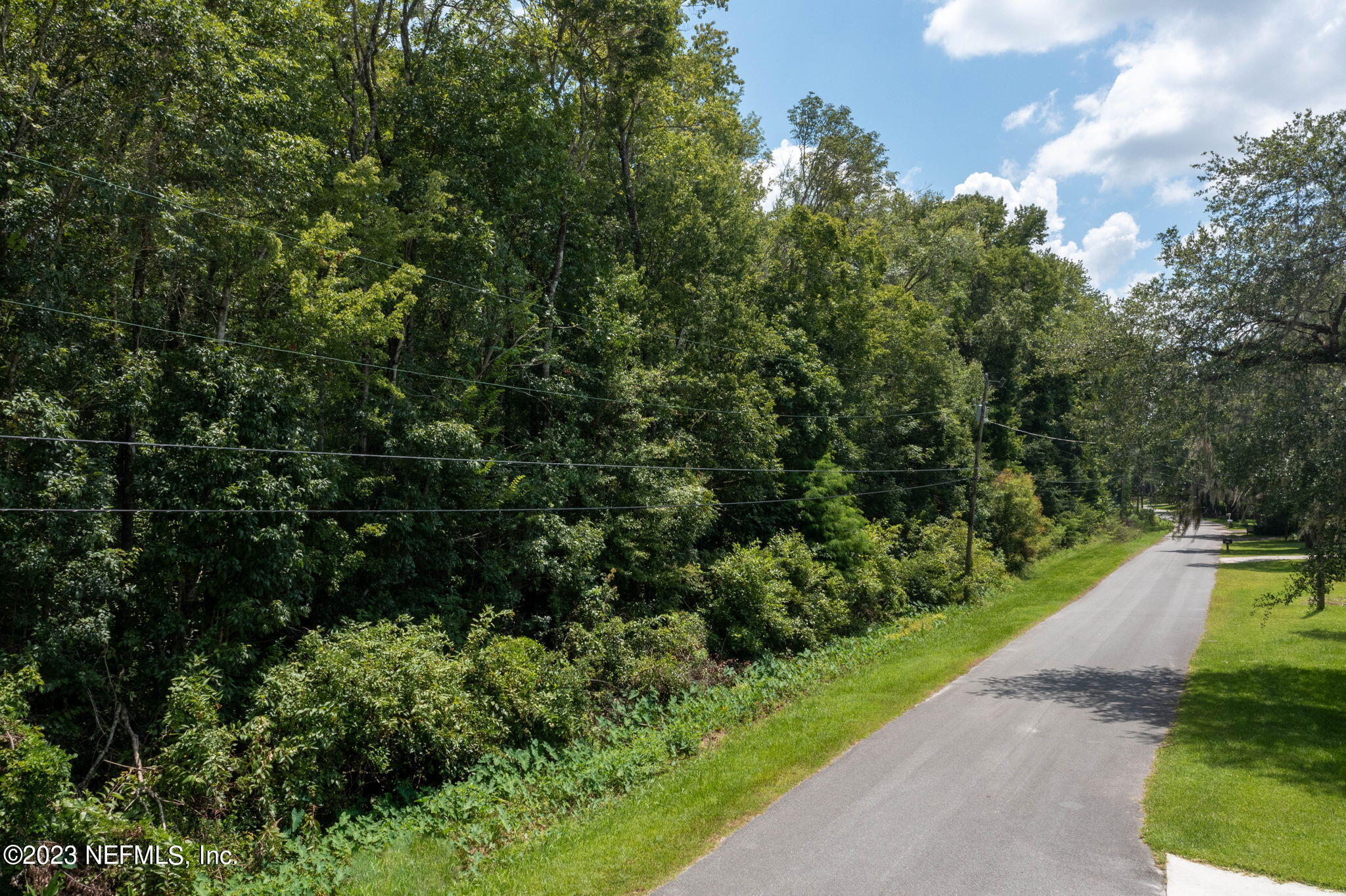 3716 Main Street Middleburg, FL 32068 - Photo 7 of 41 a view of a street with a trees