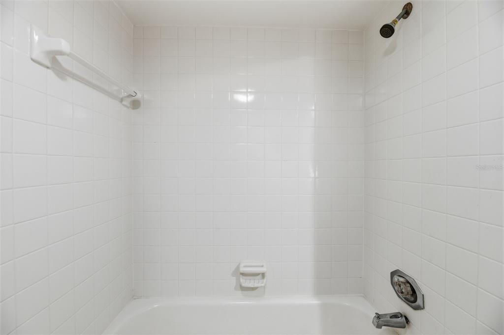 238 Woodland Road Palm Springs, FL 33461 - Photo 23 of 33 a bathroom with a bathtub