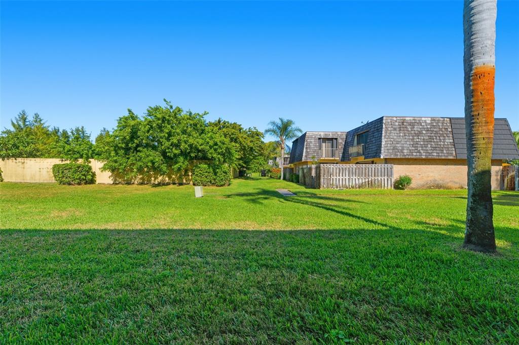 238 Woodland Road Palm Springs, FL 33461 - Photo 29 of 33 a view of an house with a garden and yard
