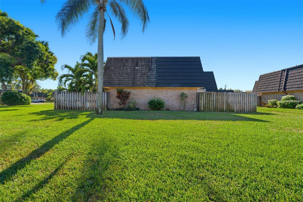 238 Woodland Road Palm Springs, FL 33461 - Photo 31 of 33 a view of a house with a yard