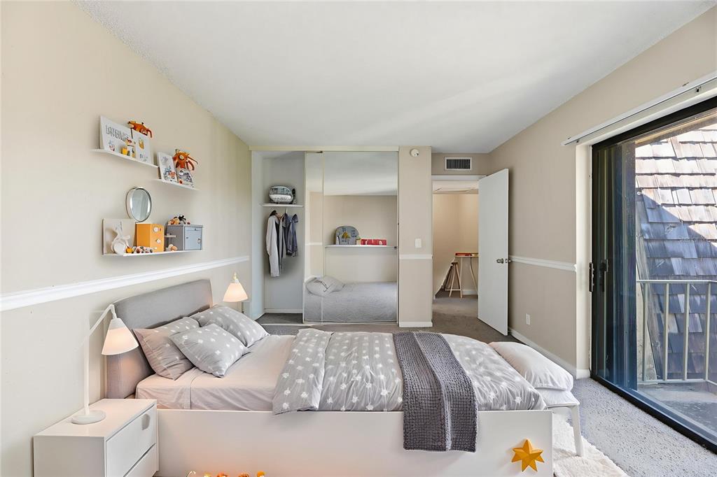 238 Woodland Road Palm Springs, FL 33461 - Photo 4 of 33 a bedroom with a bed and a large window