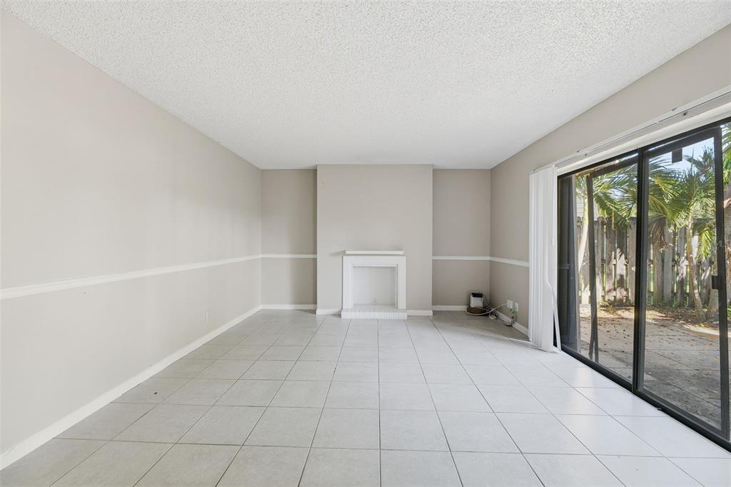 238 Woodland Road Palm Springs, FL 33461 - Photo 7 of 33 a view of an empty room with a window