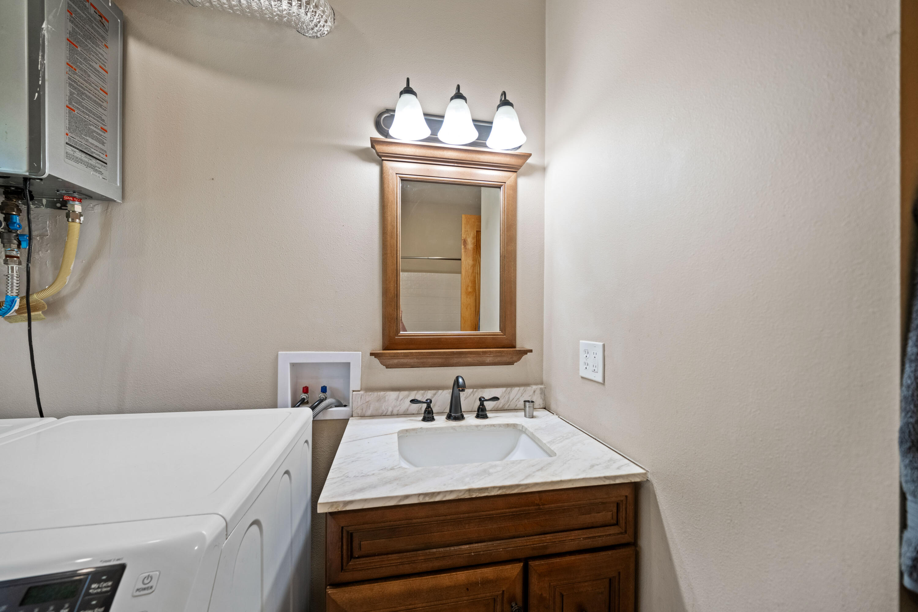 8916 Reading Creek Road Douglas City, CA 96024 - Photo 21 of 48 a bathroom with a sink a mirror and a vanity