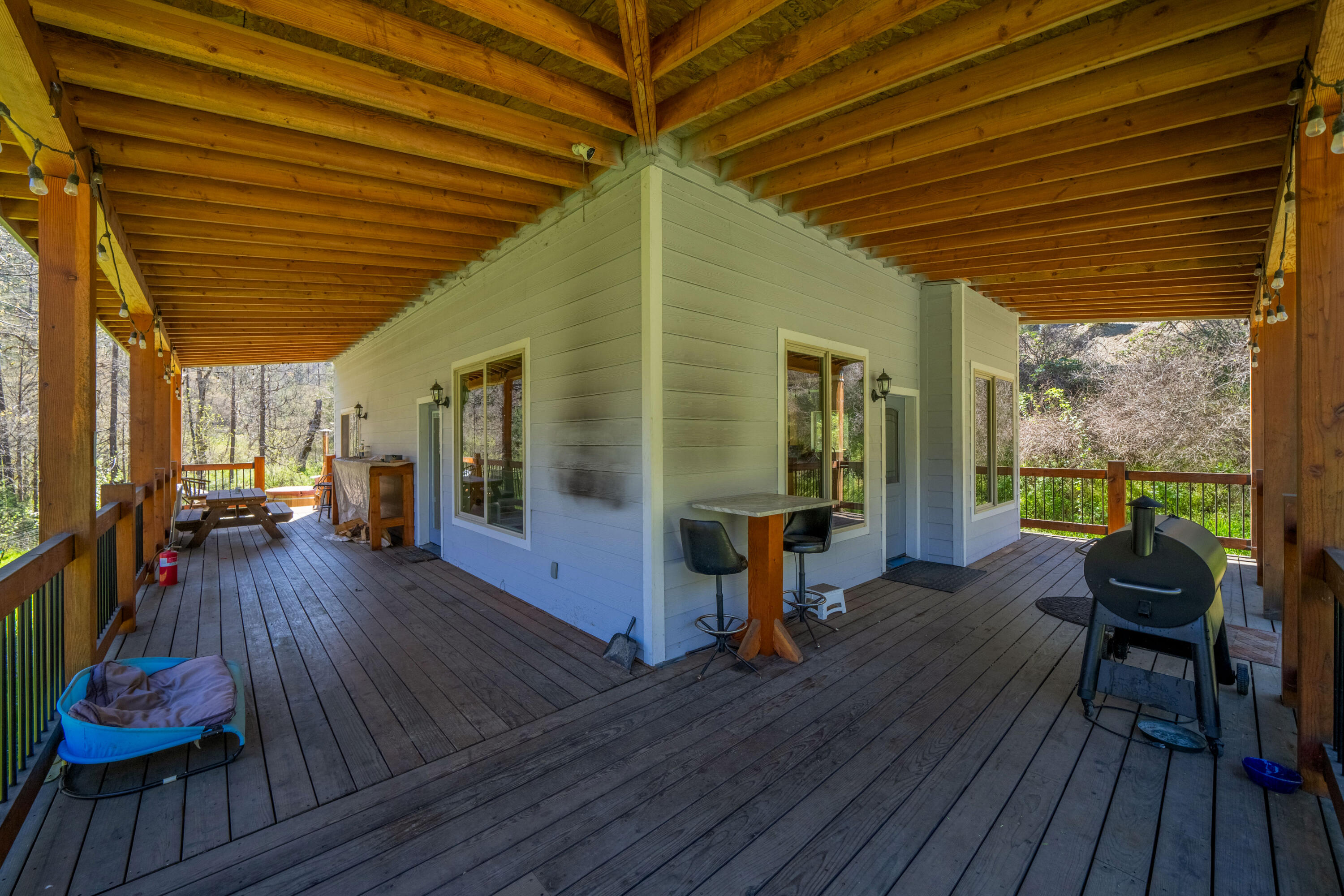 8916 Reading Creek Road Douglas City, CA 96024 - Photo 24 of 48 a view of a patio with wooden floor and outdoor seating