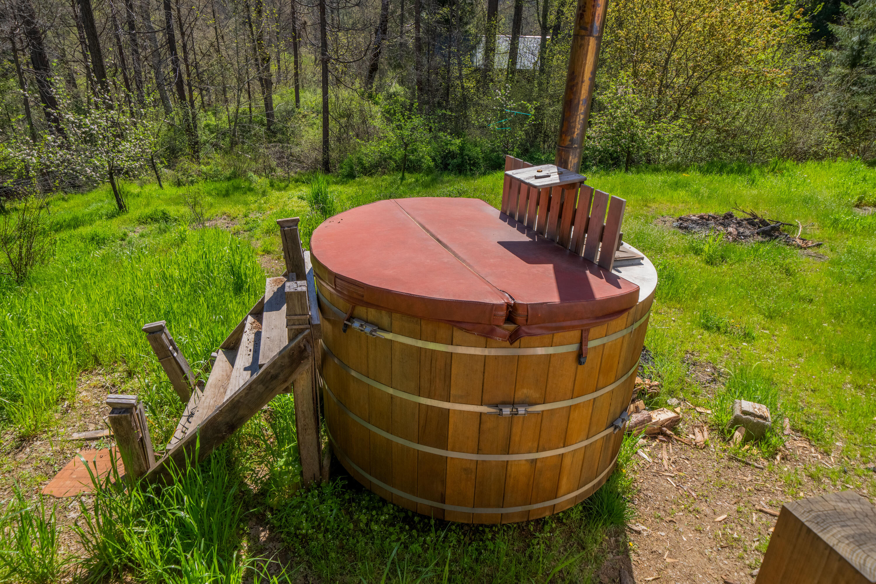8916 Reading Creek Road Douglas City, CA 96024 - Photo 29 of 48 a view of a patio with table and chairs potted plants and large tree