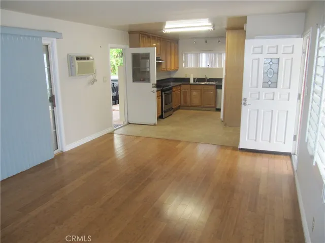 a view of a kitchen with a sink cabinets and a window