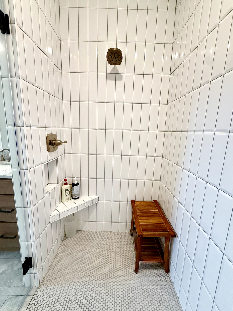 5077 Oak Rdg Court Bettendorf, IA 52722 - Photo 16 of 35 a bathroom with a sink a toilet and shower