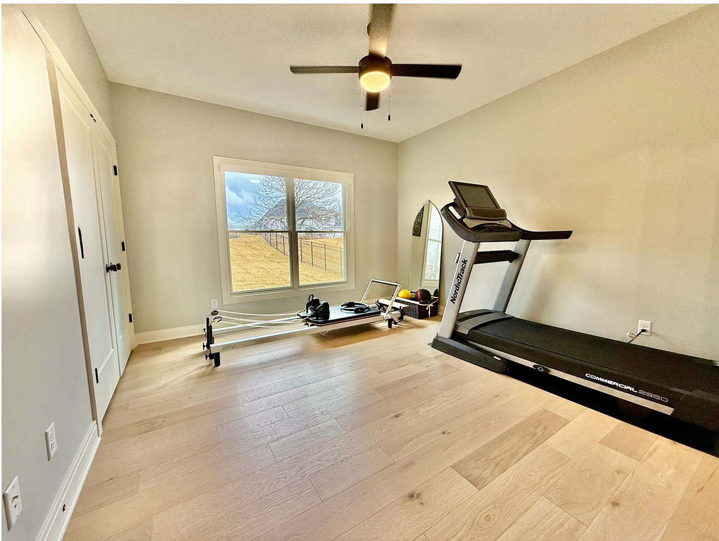 5077 Oak Rdg Court Bettendorf, IA 52722 - Photo 20 of 35 a view of a room with gym equipment