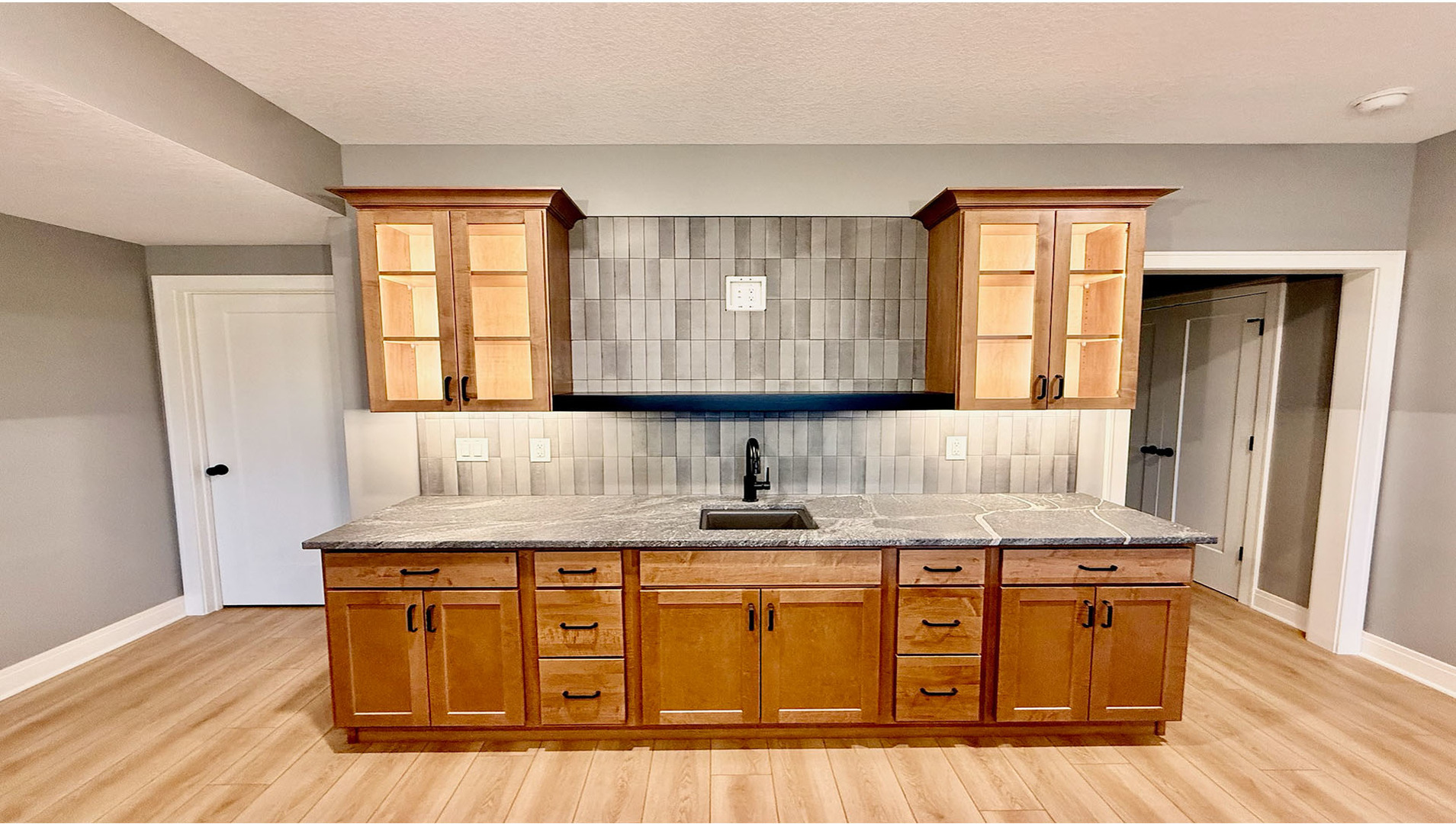 5077 Oak Rdg Court Bettendorf, IA 52722 - Photo 26 of 35 a kitchen with stainless steel appliances granite countertop a sink stove and cabinets