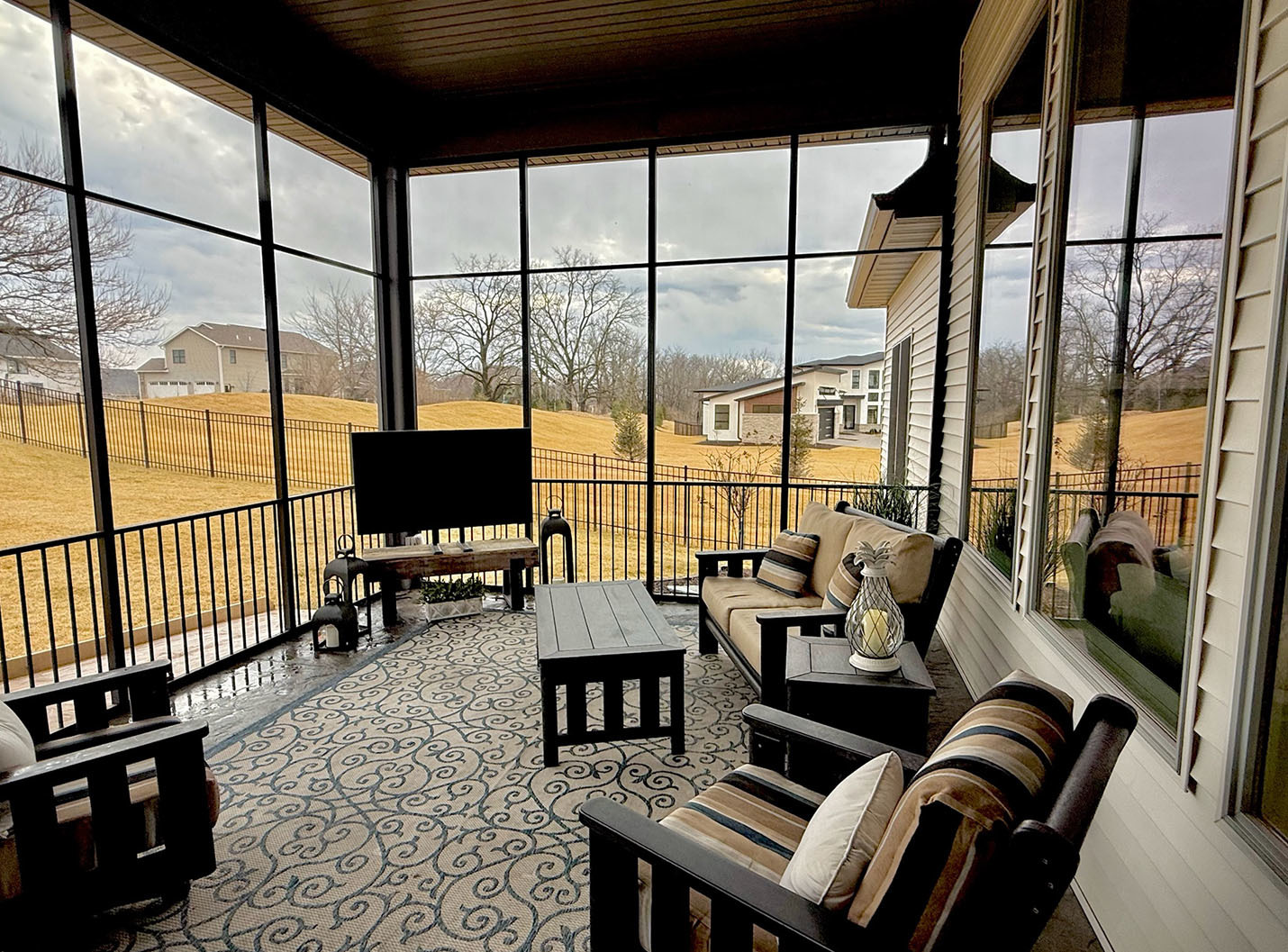 5077 Oak Rdg Court Bettendorf, IA 52722 - Photo 33 of 35 a living room with furniture and a flat screen tv