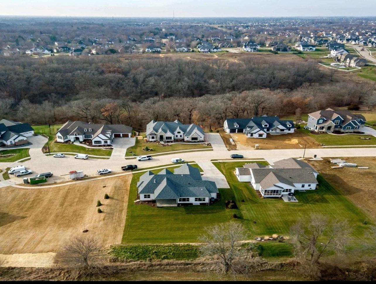 5077 Oak Rdg Court Bettendorf, IA 52722 - Photo 35 of 35 an aerial view of a house with a garden and lake view