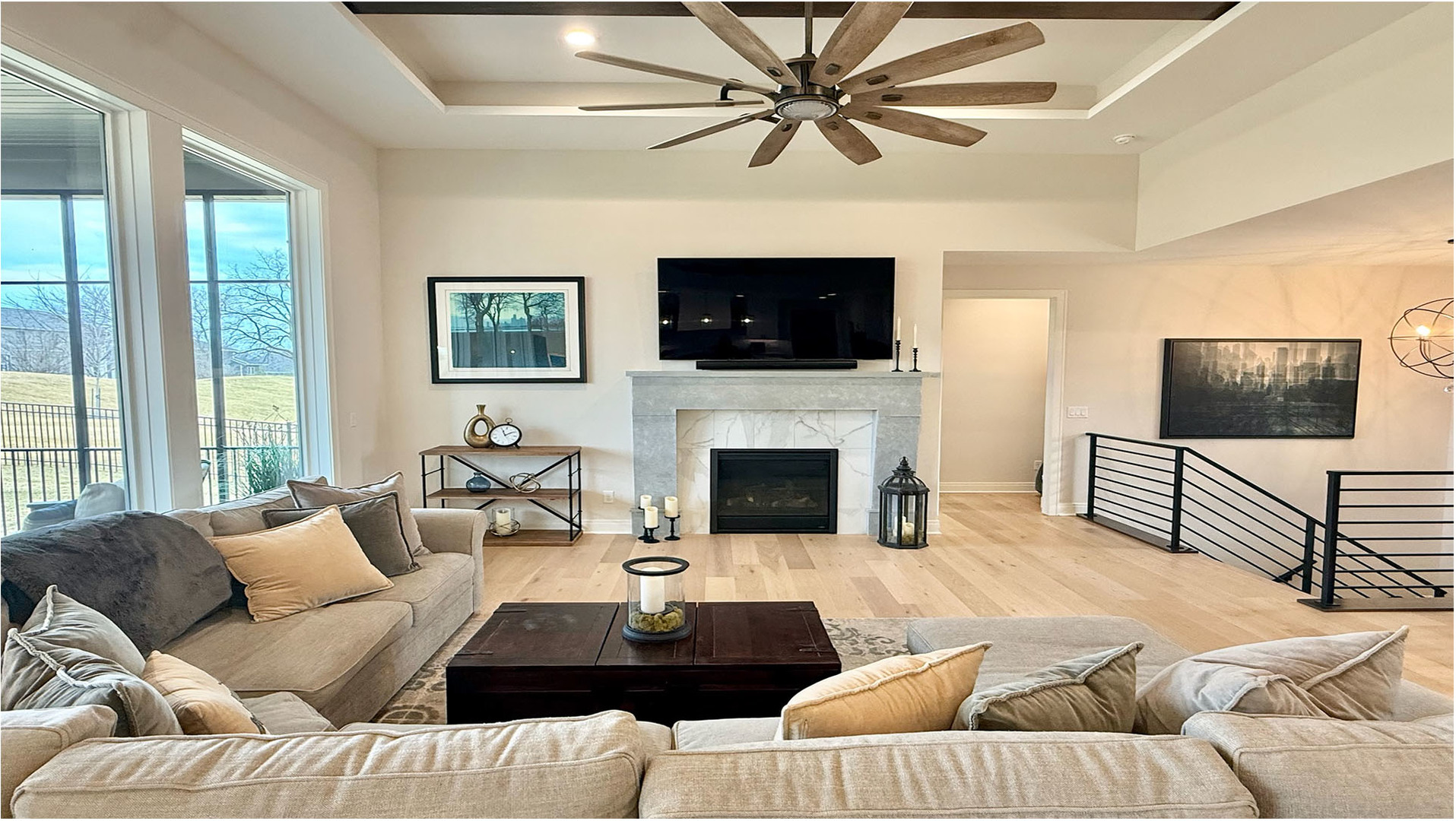 5077 Oak Rdg Court Bettendorf, IA 52722 - Photo 6 of 35 a living room with furniture a flat screen tv and a fireplace
