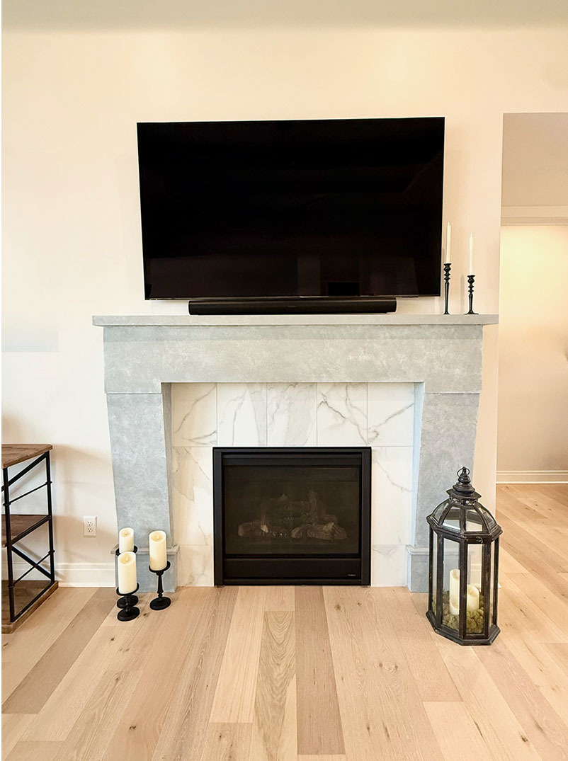 5077 Oak Rdg Court Bettendorf, IA 52722 - Photo 7 of 35 a living room with a fireplace and a flat screen tv