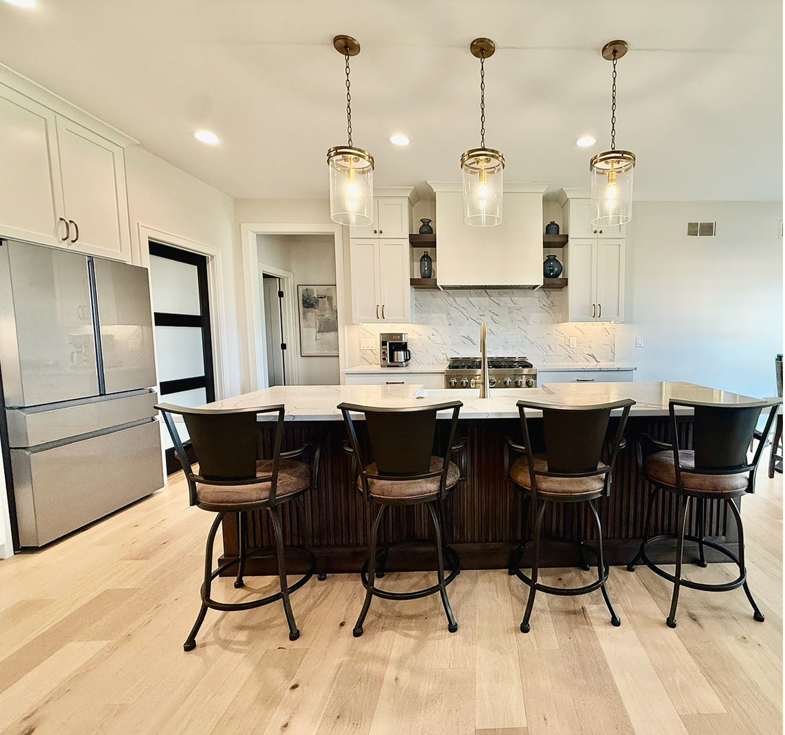 5077 Oak Rdg Court Bettendorf, IA 52722 - Photo 9 of 35 a kitchen with a dining table chairs and cabinets
