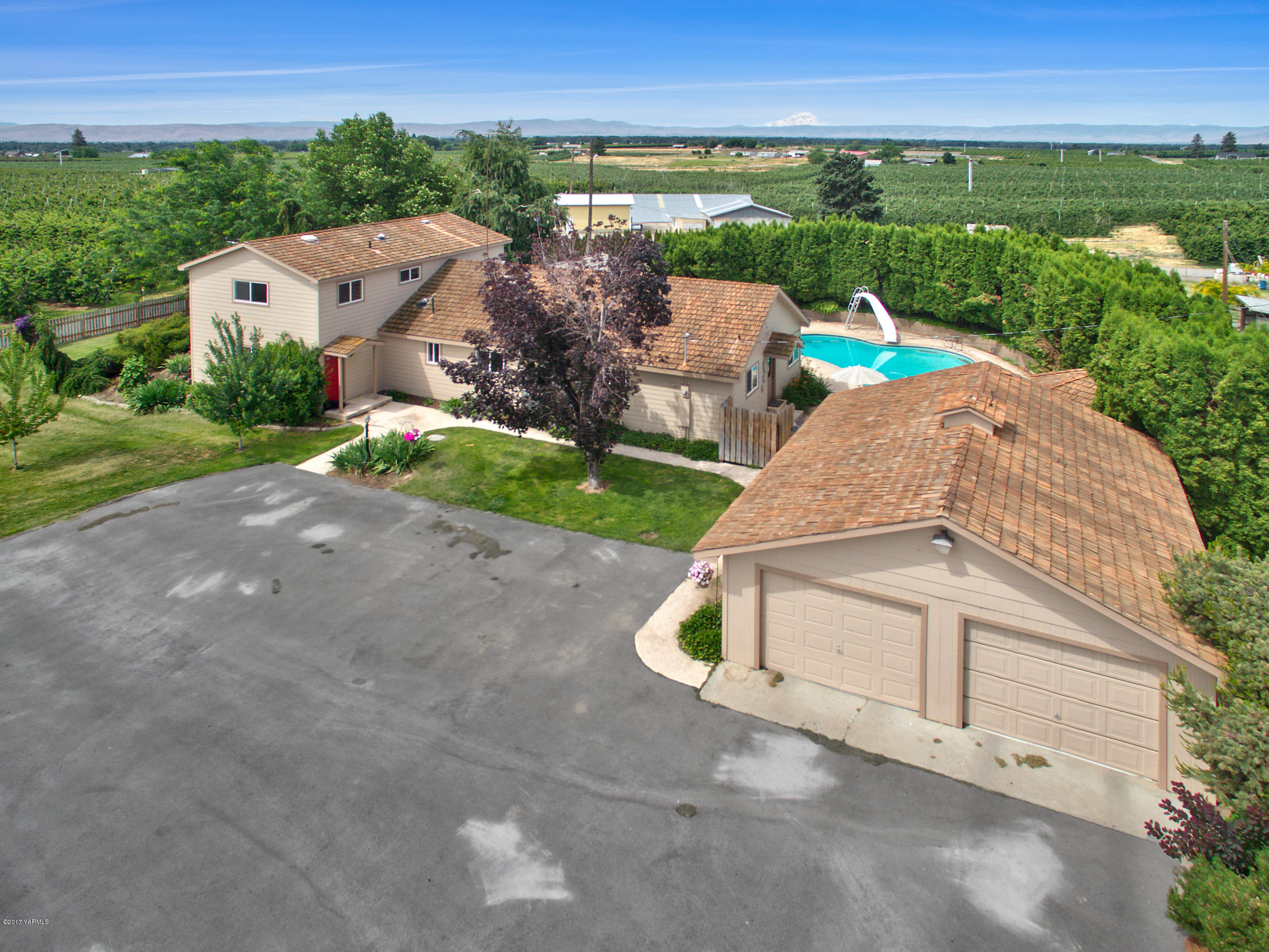 370 Blue Goose Road Zillah, WA 98953 - Photo 1 of 31 an aerial view of a house with outdoor space and street view