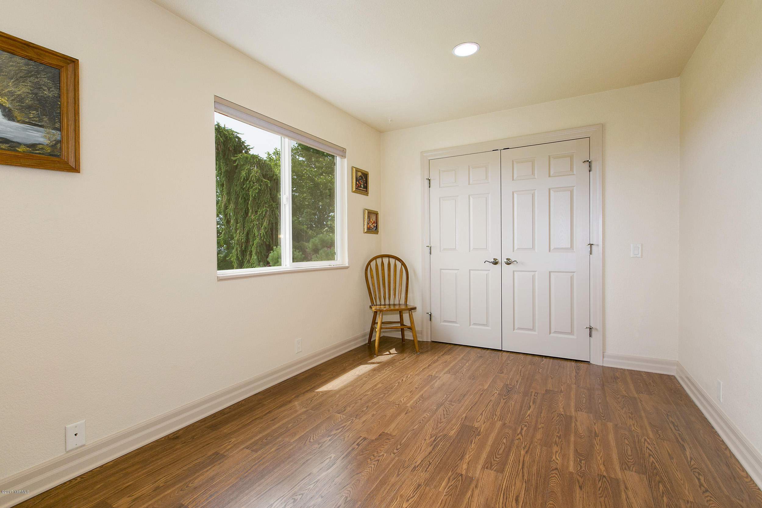 370 Blue Goose Road Zillah, WA 98953 - Photo 14 of 31 a view of empty room with wooden floor and fan