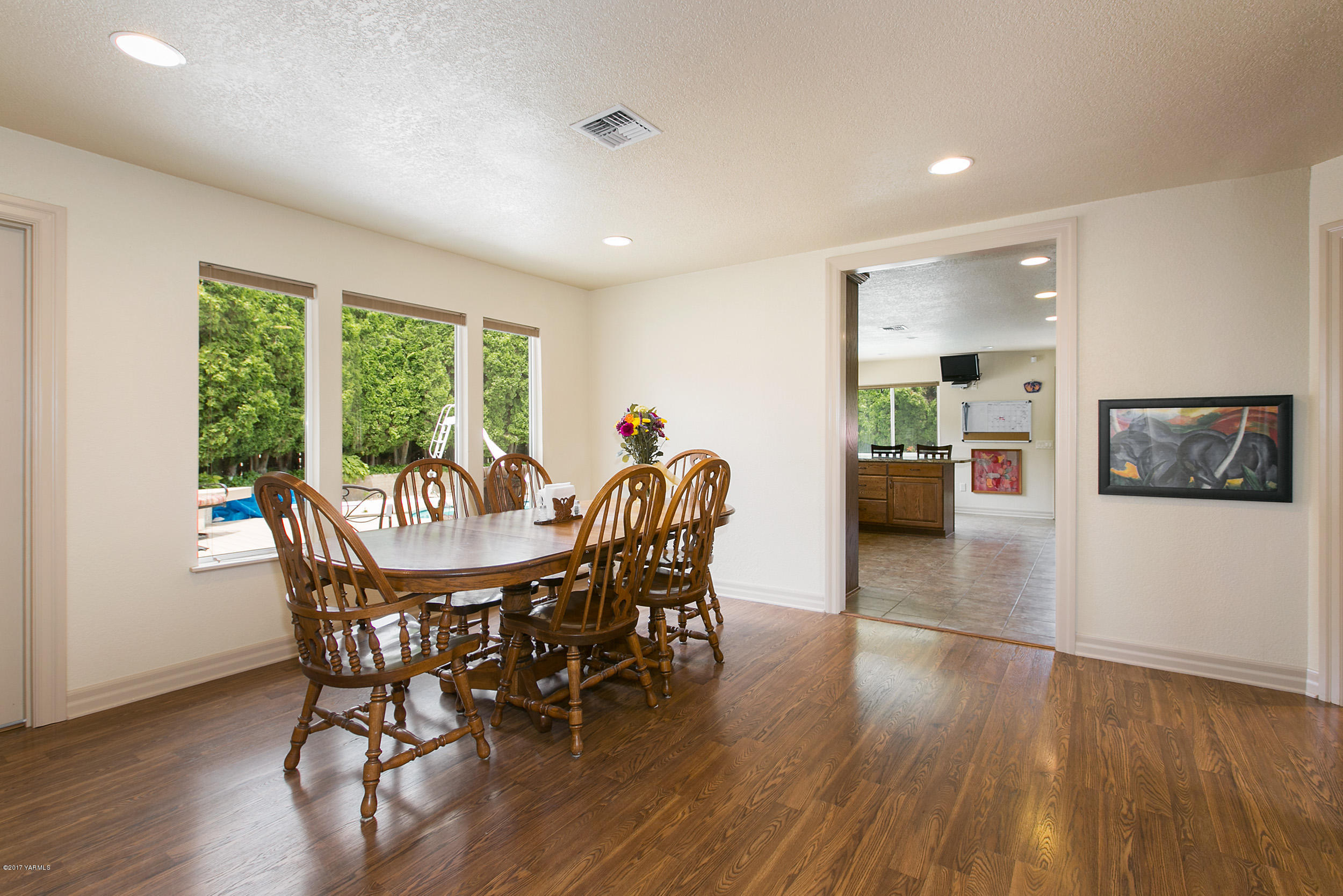 370 Blue Goose Road Zillah, WA 98953 - Photo 8 of 31 a view of a dining room with furniture window and wooden floor