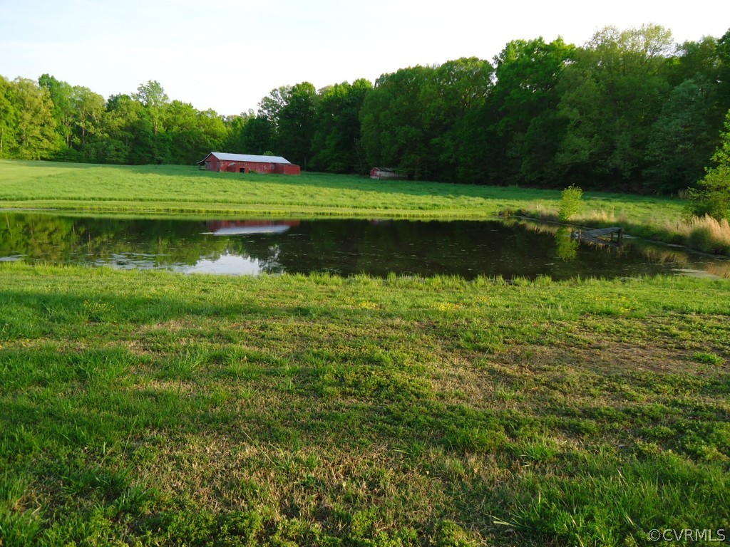 1972 Willow Brook Road Bumpass, VA 23024 - Photo 3 of 18 a view of a lake with a yard
