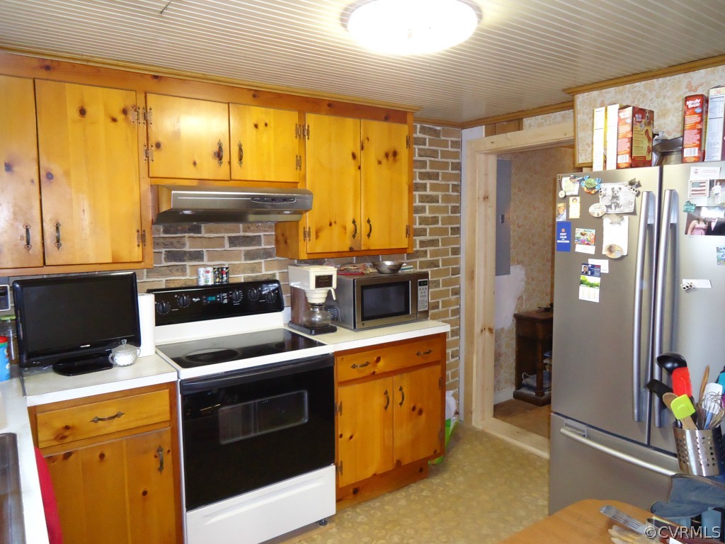1972 Willow Brook Road Bumpass, VA 23024 - Photo 9 of 18 a kitchen with a stove a refrigerator and a window