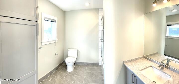 56 Old Field Point Road, Unit 6 Greenwich, CT 06830 - Photo 19 of 28 a bathroom with a sink and a toilet