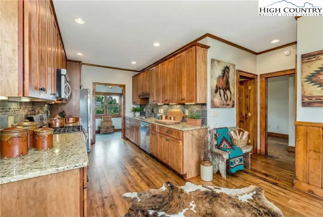 a spacious bedroom with a bed and a chandelier
