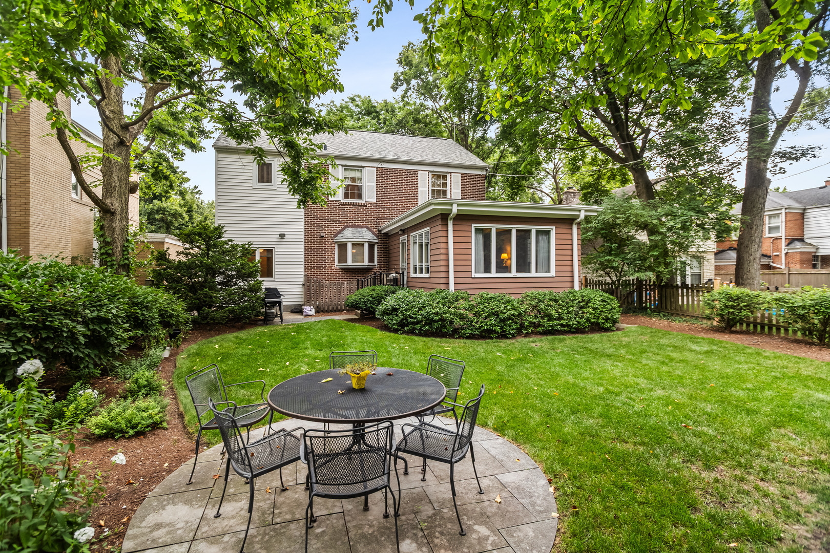 1227 16th Street Wilmette, IL 60091 - Photo 28 of 30 a view of a house with backyard sitting area and garden