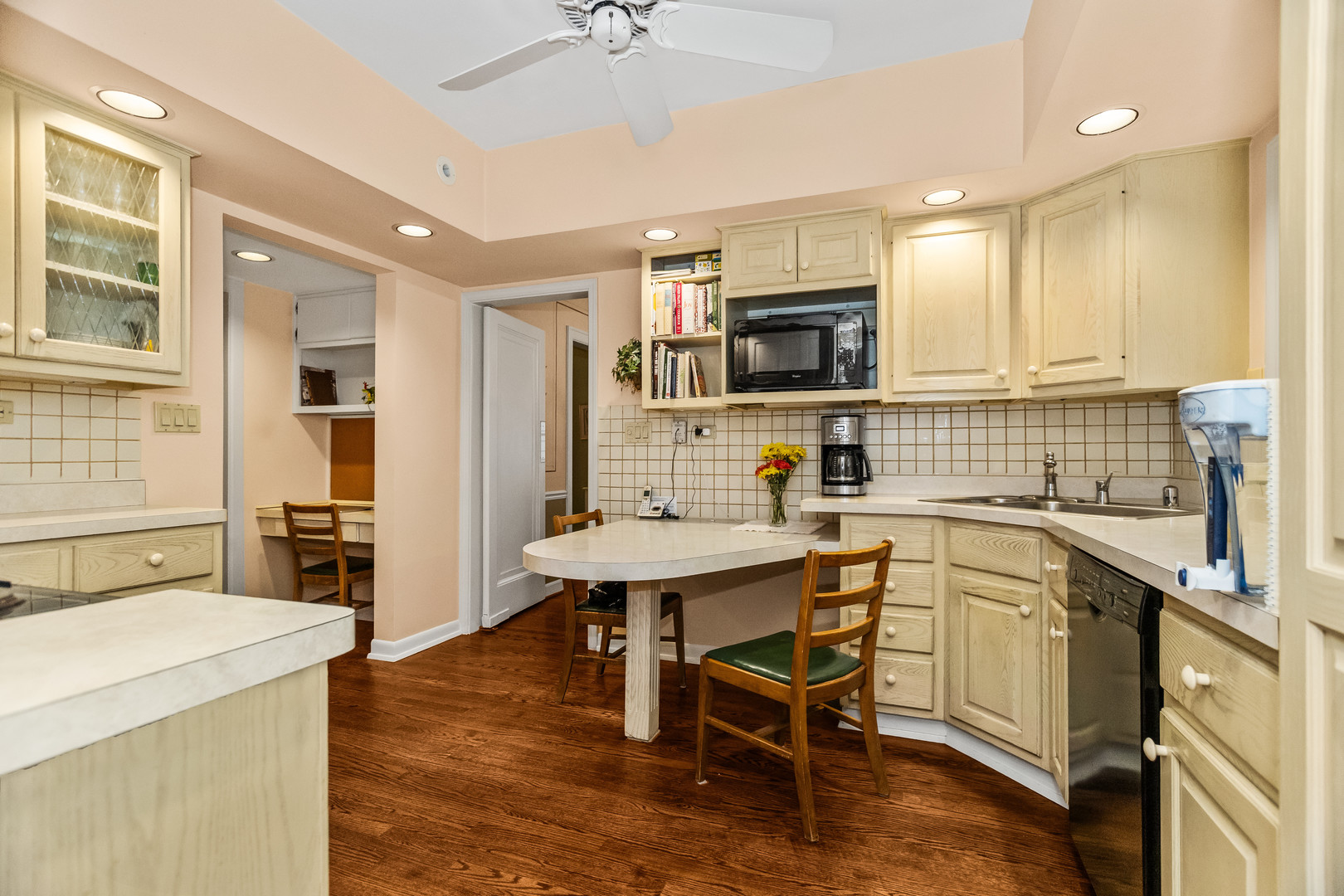 1227 16th Street Wilmette, IL 60091 - Photo 10 of 30 a kitchen with a sink stove and microwave