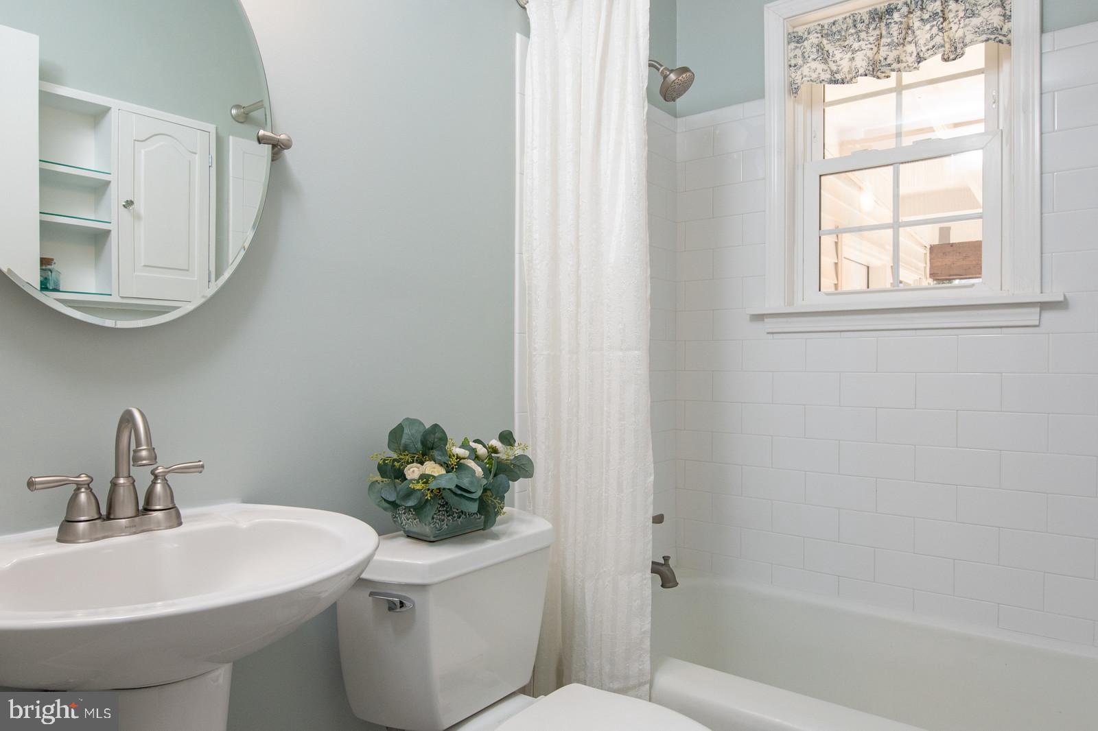 1605 Shenandoah Road Alexandria, VA 22308 - Photo 19 of 40 New tile, pedestal sink and fixtures around tub