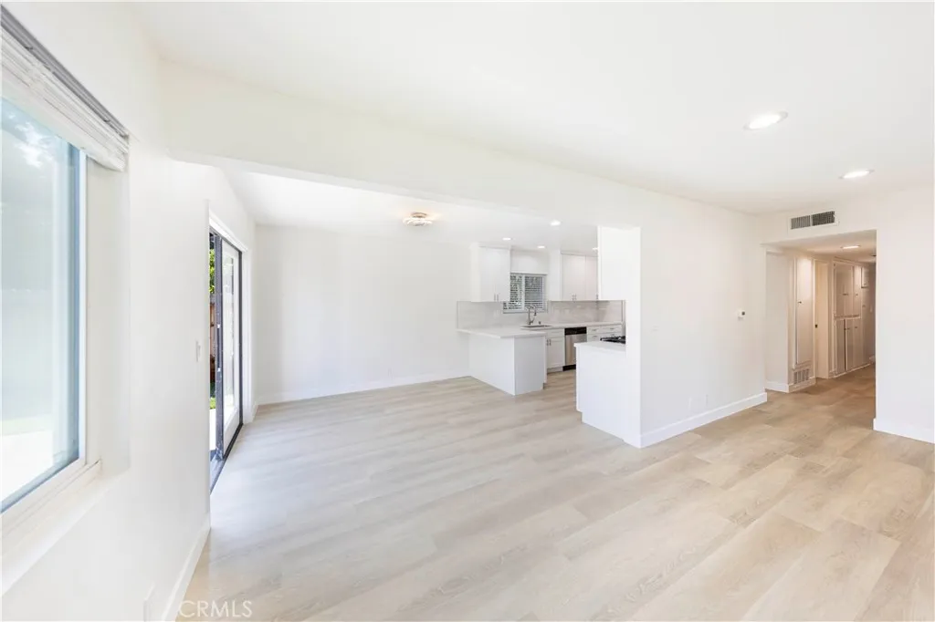 2477 Orange, Unit A Costa Mesa, CA 92626 - Photo 11 of 21 a view of a kitchen with refrigerator and white cabinets