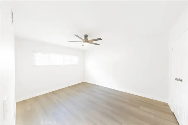 a view of a small space with wooden floor