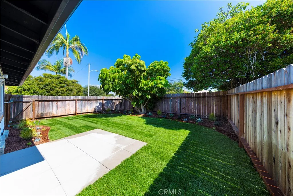 2477 Orange, Unit A Costa Mesa, CA 92626 - Photo 18 of 21 a view of a backyard with wooden fence