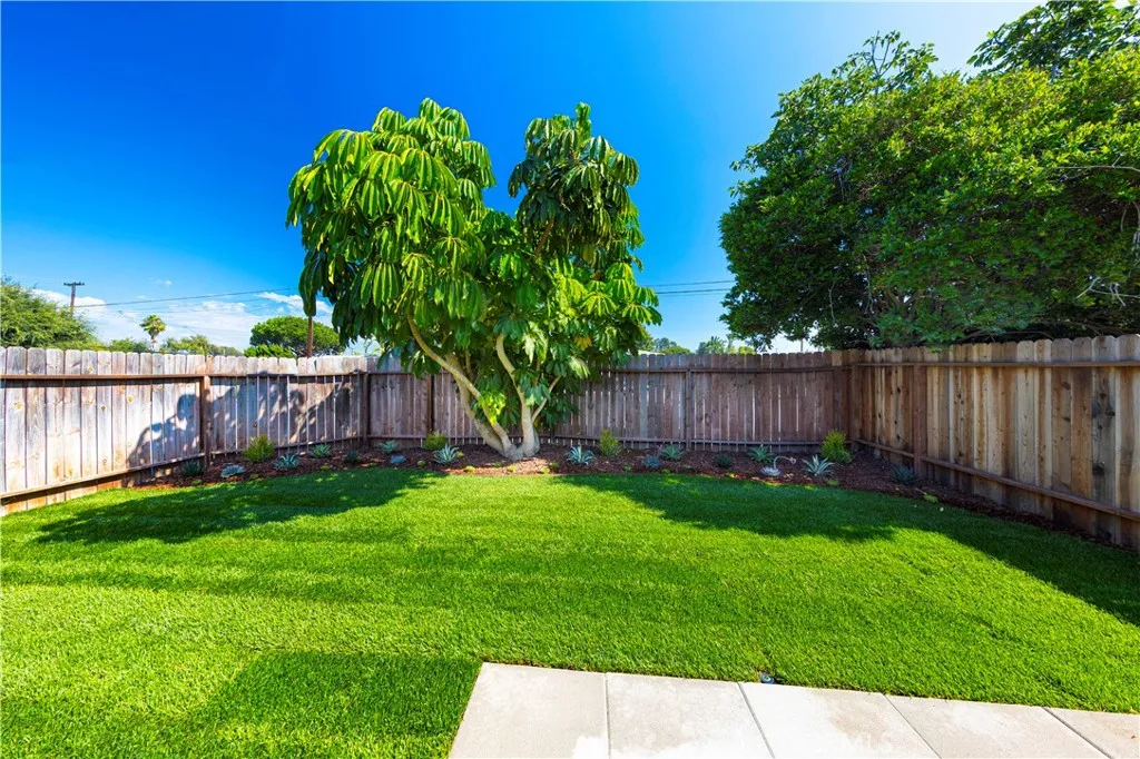 2477 Orange, Unit A Costa Mesa, CA 92626 - Photo 20 of 21 a view of a backyard with wooden fence