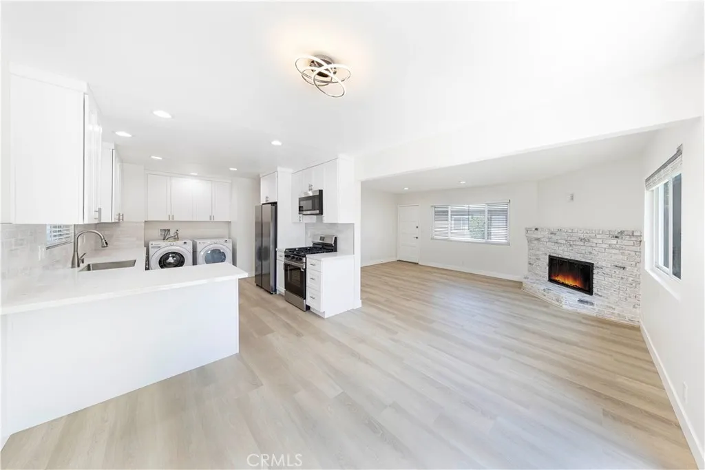 2477 Orange, Unit A Costa Mesa, CA 92626 - Photo 4 of 21 a view of kitchen with furniture and wooden floor