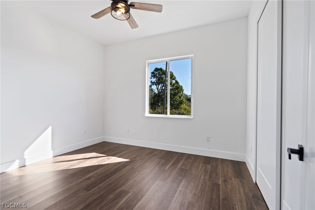 97 Brig Circle East Placida, FL 33946 - Photo 11 of 23 wooden floor in an empty room with a window