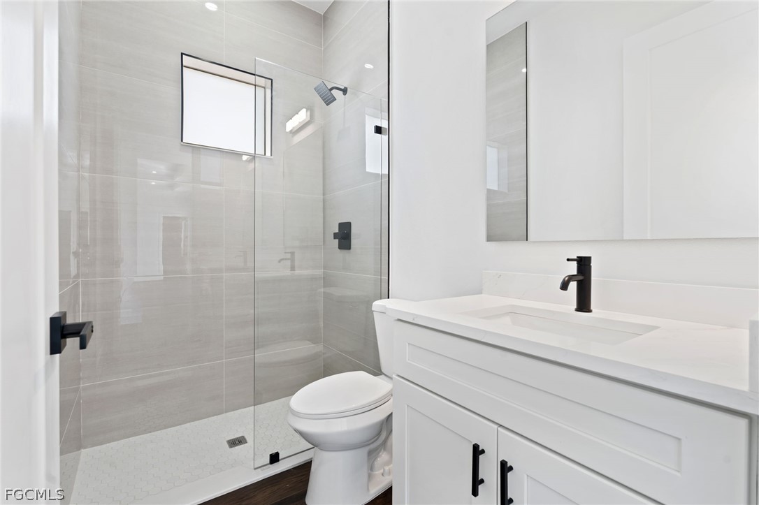 97 Brig Circle East Placida, FL 33946 - Photo 12 of 23 a bathroom with a sink a toilet and shower