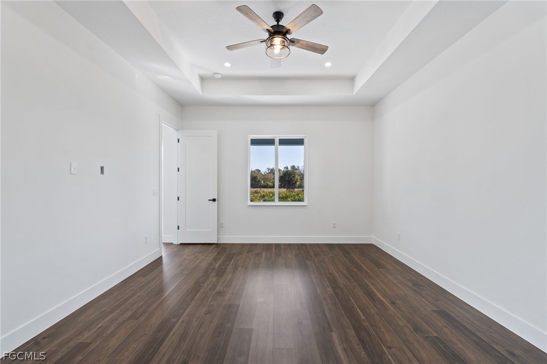 97 Brig Circle East Placida, FL 33946 - Photo 13 of 23 wooden floor in an empty room with a window