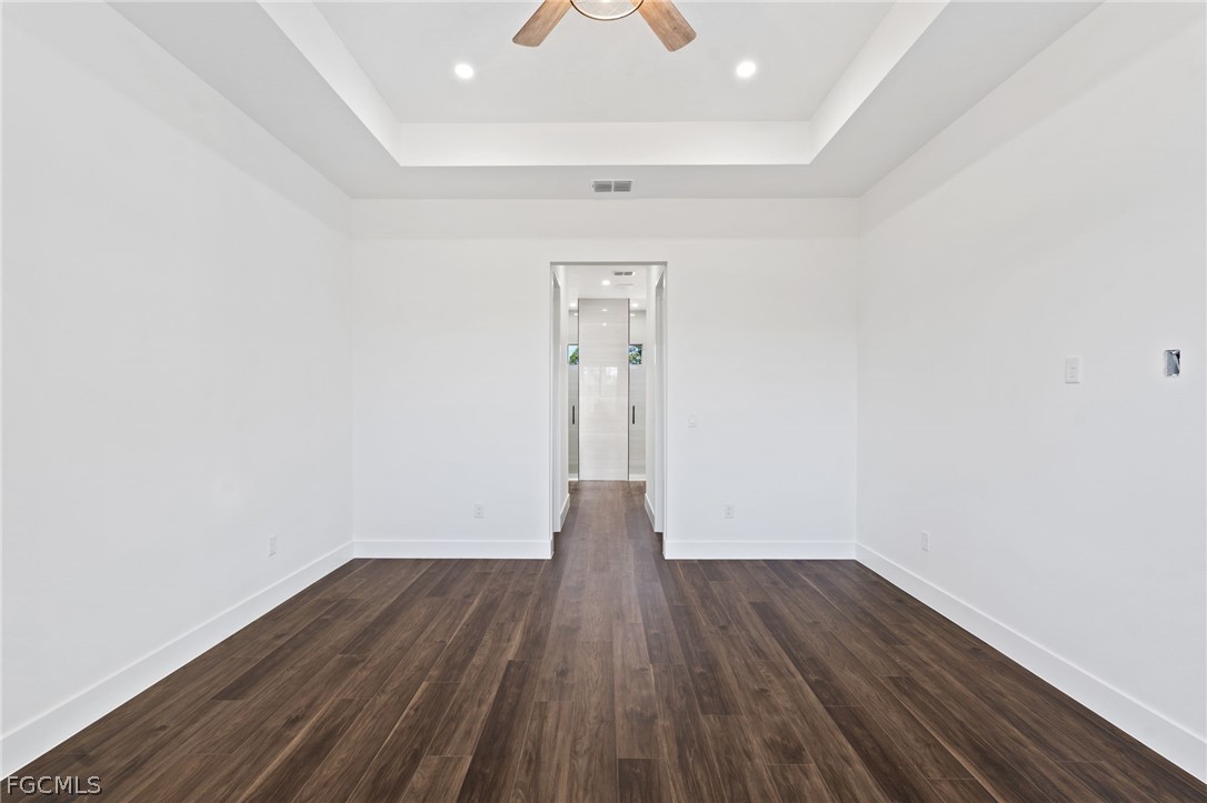97 Brig Circle East Placida, FL 33946 - Photo 14 of 23 a view of a room with wooden floor and a chandelier