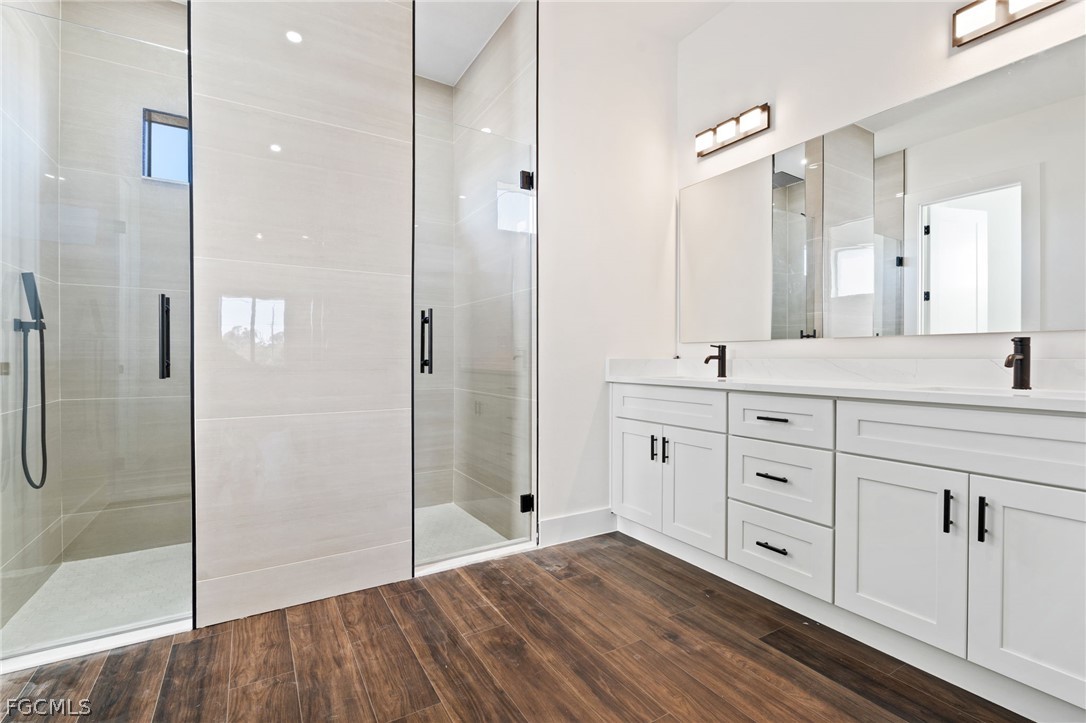 97 Brig Circle East Placida, FL 33946 - Photo 15 of 23 a spacious bathroom with a shower sink and mirror