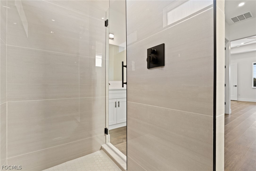 97 Brig Circle East Placida, FL 33946 - Photo 16 of 23 a bathroom with a shower and a mirror