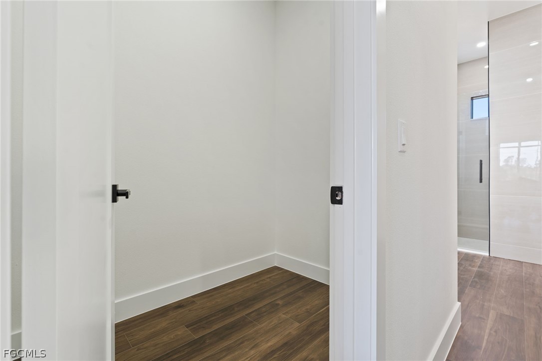 97 Brig Circle East Placida, FL 33946 - Photo 17 of 23 a view of a hallway with wooden floor