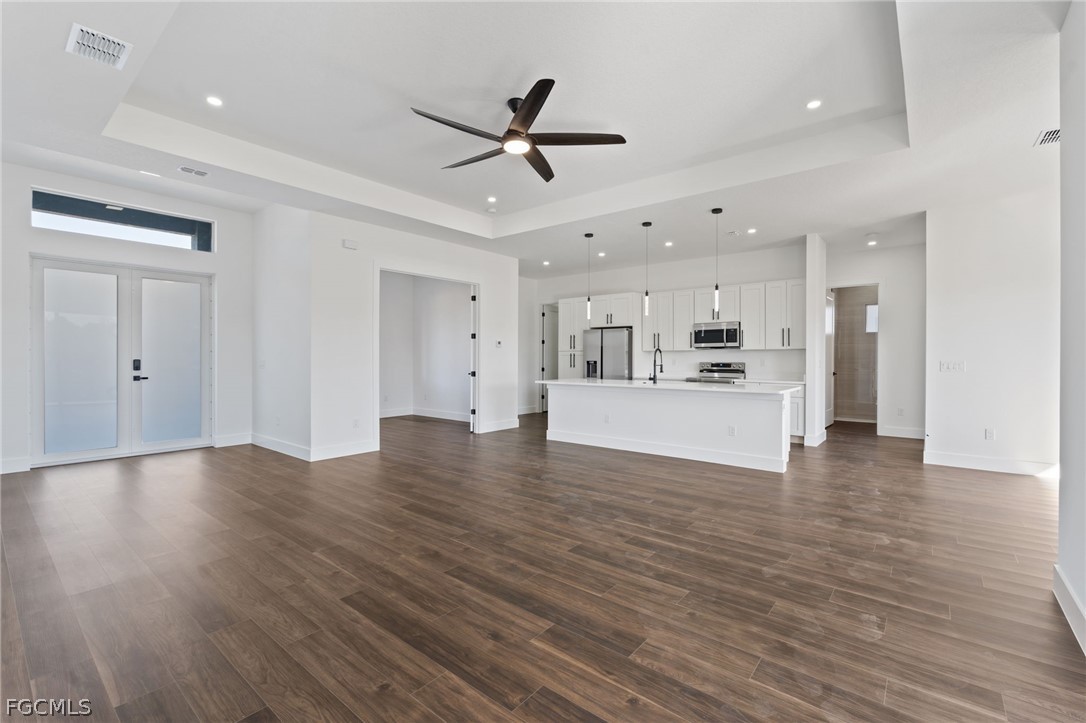97 Brig Circle East Placida, FL 33946 - Photo 2 of 23 a view of a big room with wooden floor and a kitchen