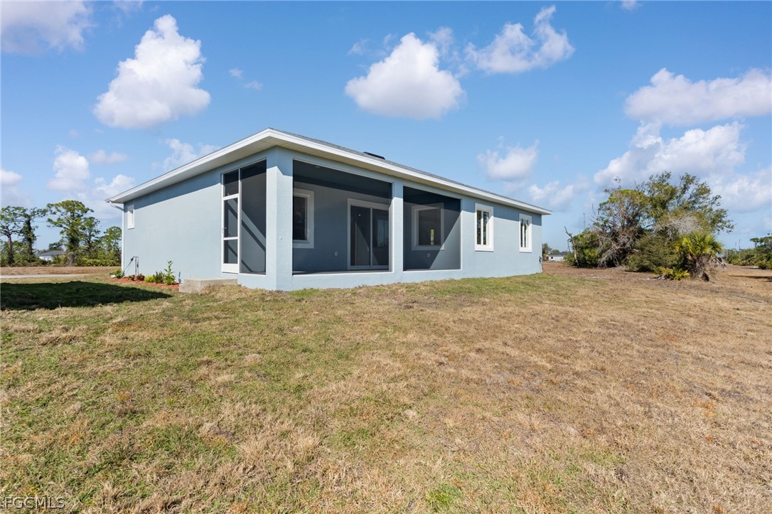 97 Brig Circle East Placida, FL 33946 - Photo 21 of 23 a view of a house with a yard