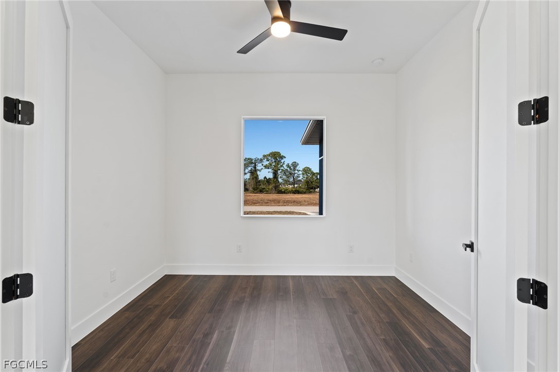 97 Brig Circle East Placida, FL 33946 - Photo 8 of 23 an empty room with wooden floor and windows