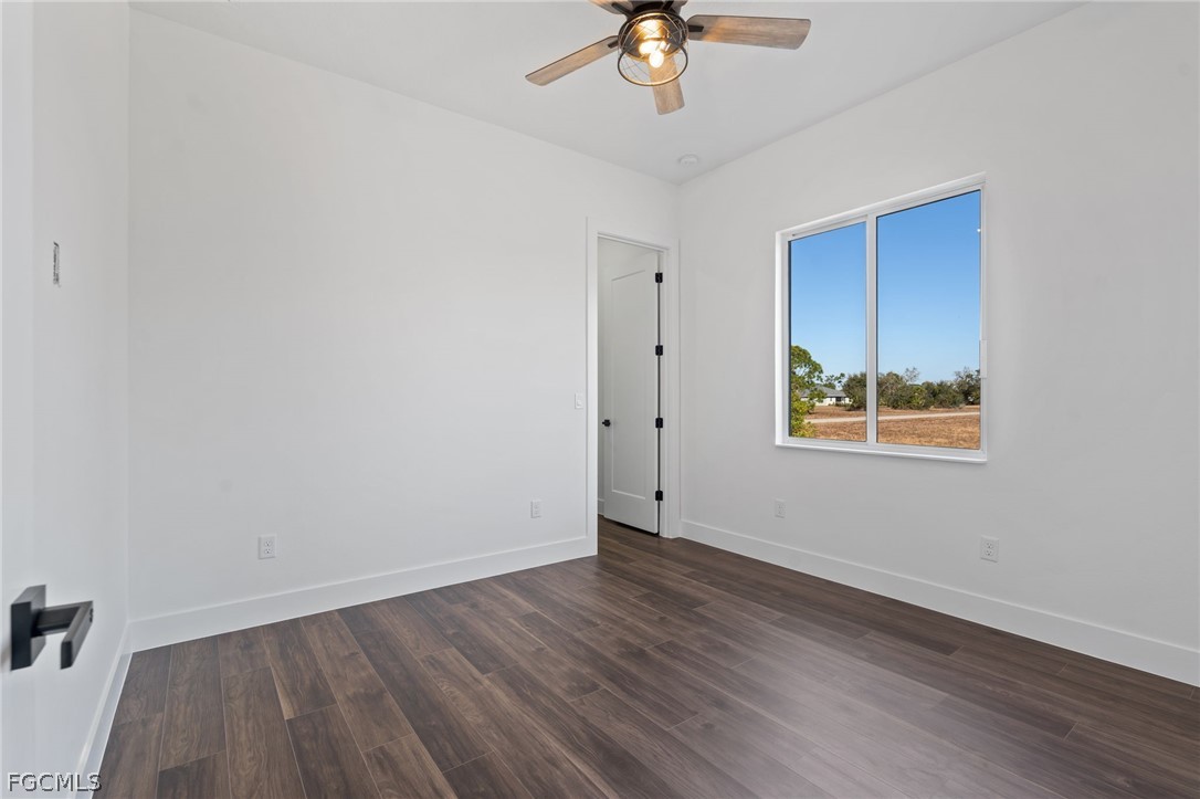 97 Brig Circle East Placida, FL 33946 - Photo 10 of 23 a view of an empty room with wooden floor and window